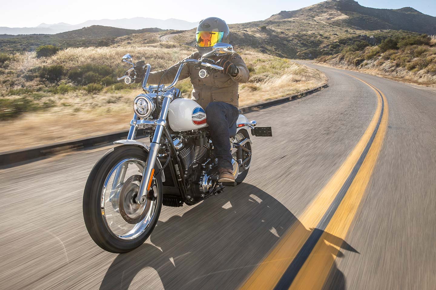 Harley-Davidson Super Glide riding on desert road