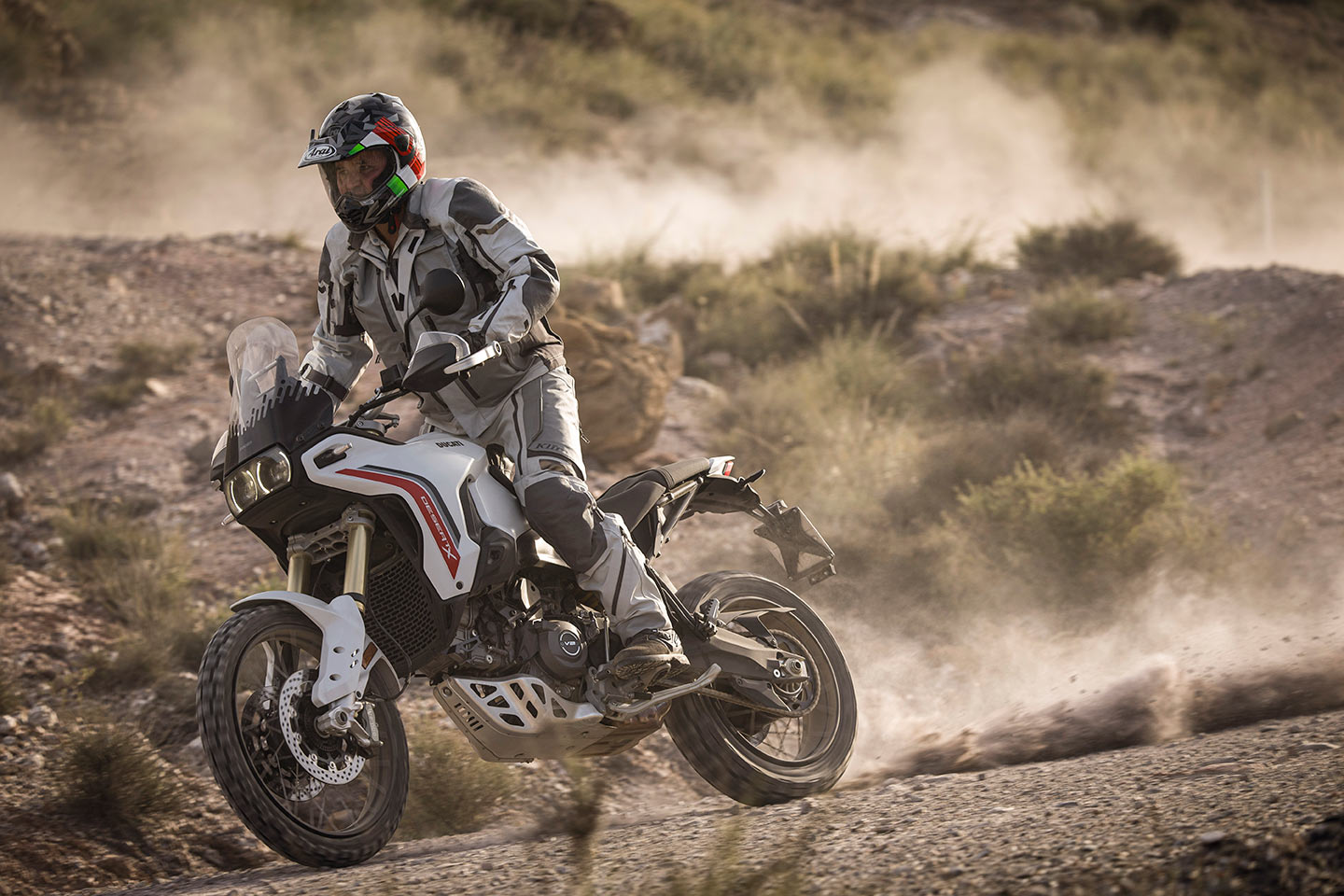 2026 Ducati DesertX riding on dusty dirt road